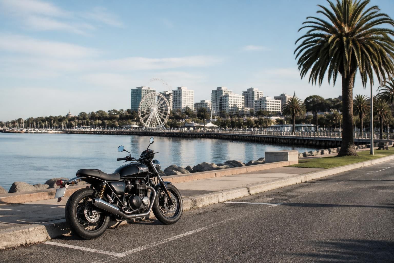 Geelong waterfront road scene with a parked motorcycle in front.